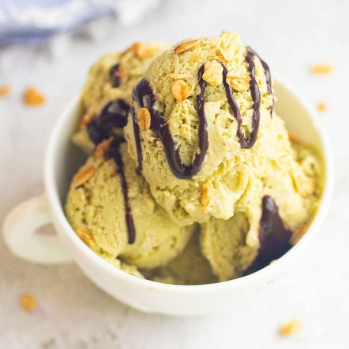 Green tea ice cream in a bowl with vegan avocado ice cream.