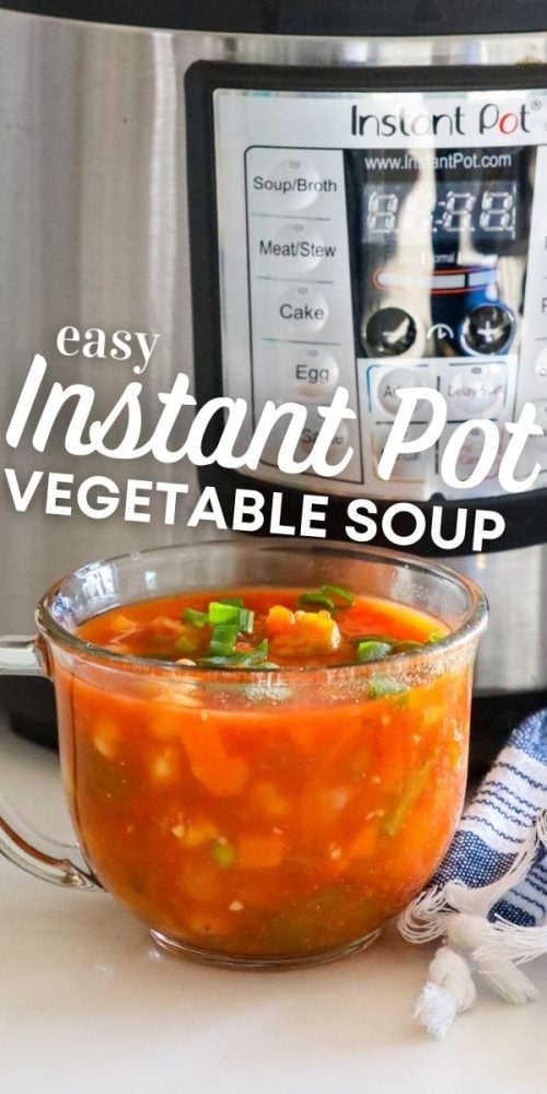 tomato and vegetable soup in a clear mug in front of an instant pot