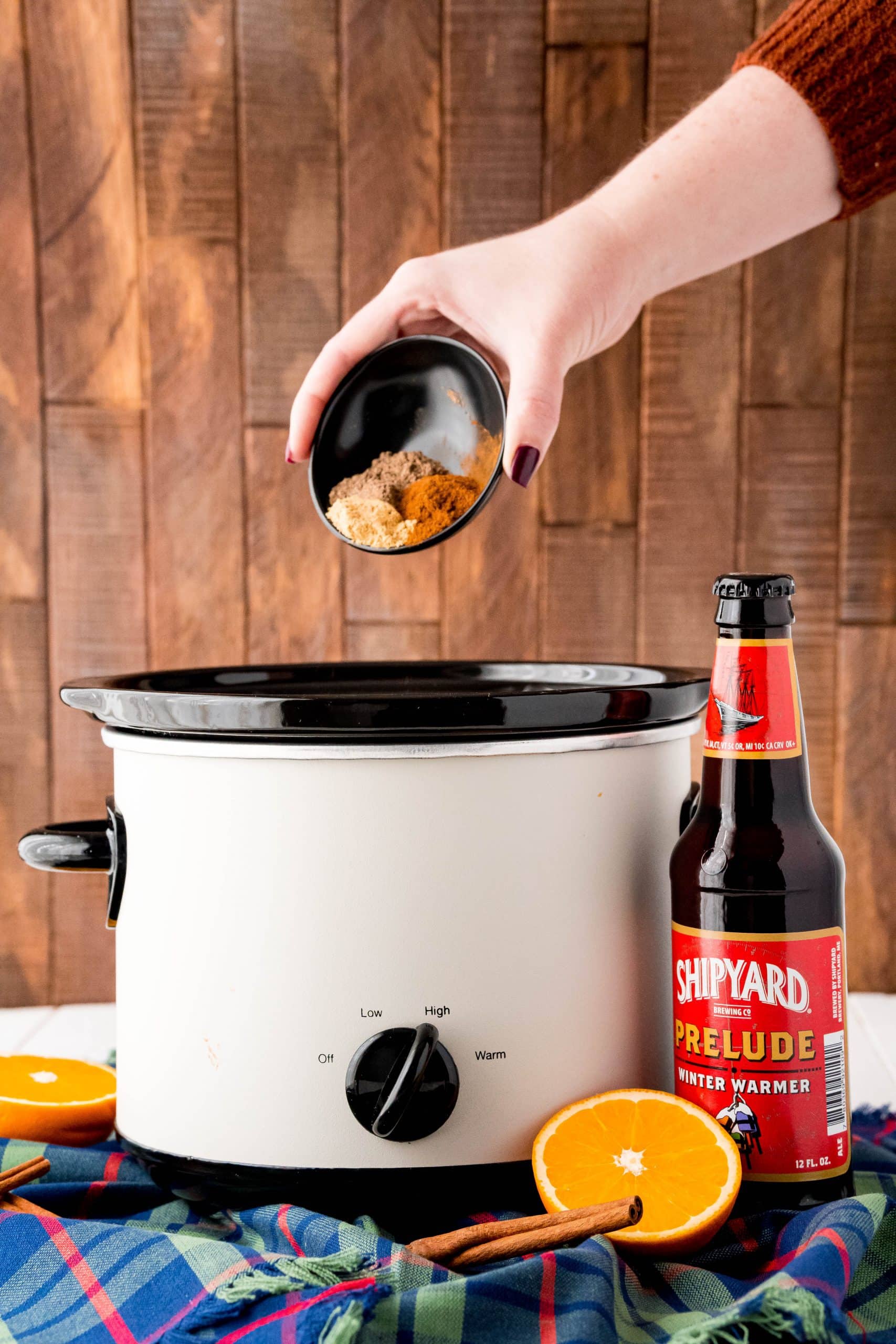 spices pouring into slow cooker