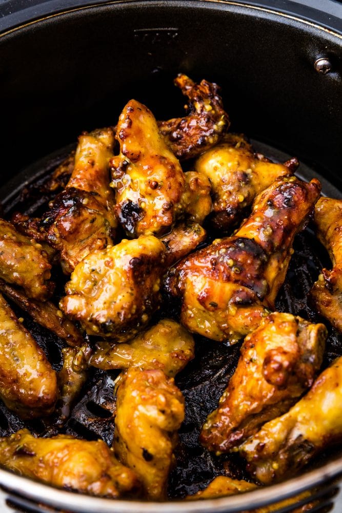 sticky wings in an air fryer basket