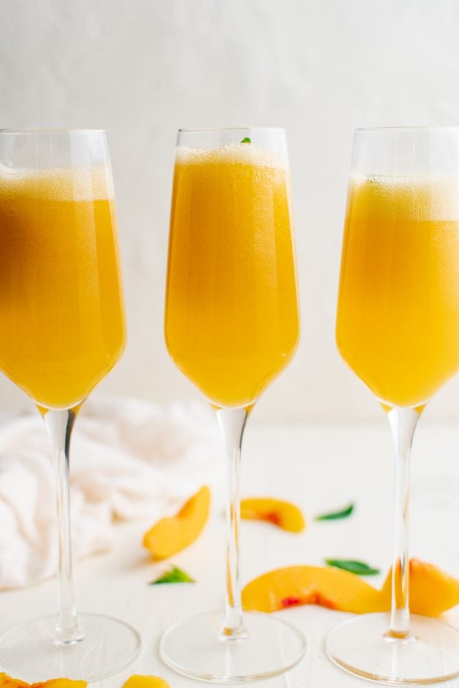 picture of peach bellinis in a champagne glass