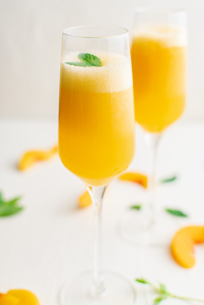 picture of peach bellinis in a champagne glass