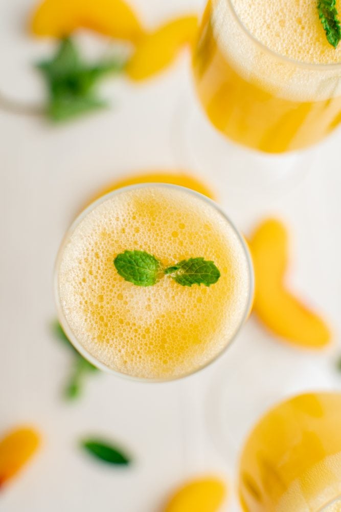 picture of peach bellinis in a champagne glass