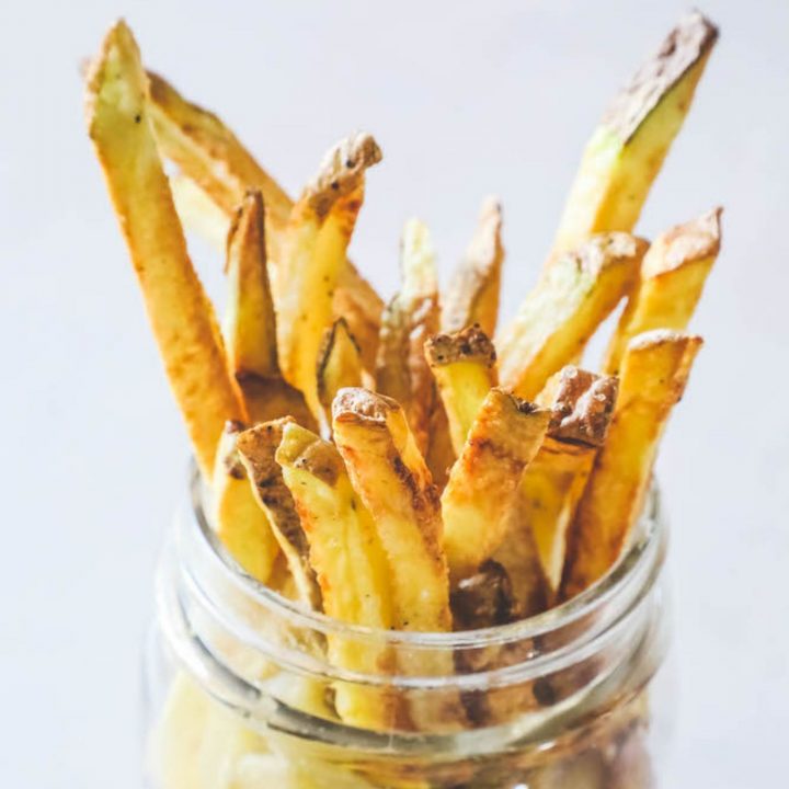 air fried french fries in a glass jar
