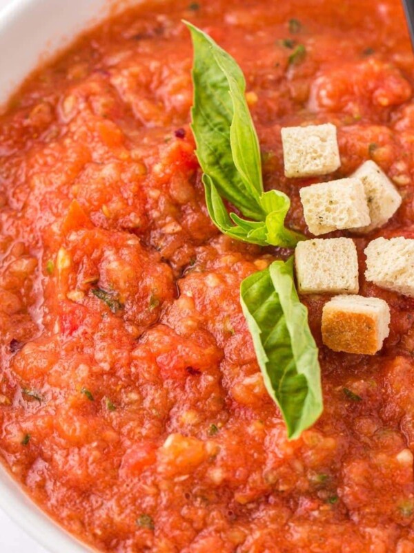 Easy gazpacho soup with croutons and basil.