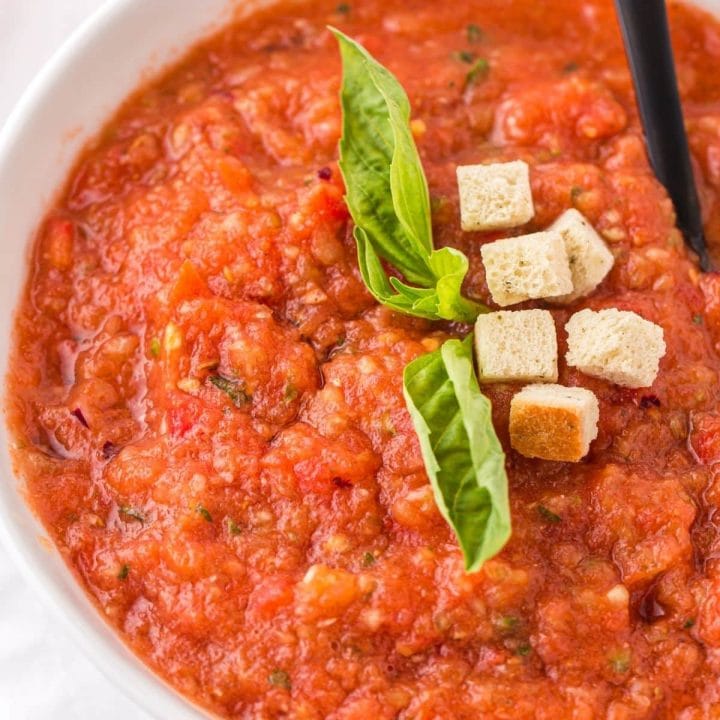 Easy gazpacho soup with croutons and basil.