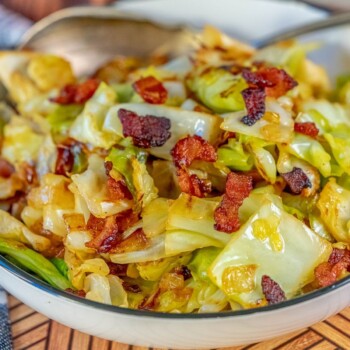 cabbage and bacon in a white bowl