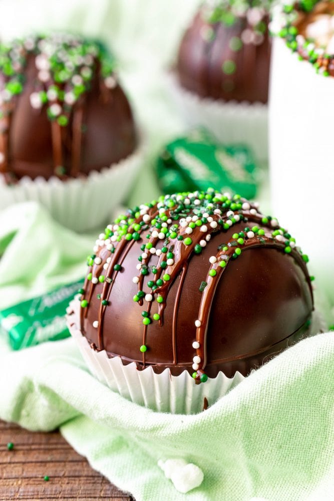 chocolate bomb in a cupcake liner with green sprinkles 