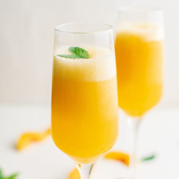 picture of peach bellinis in a champagne glass