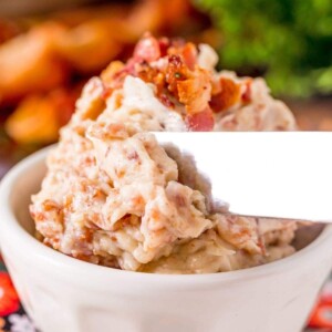 A bowl of Easy Bacon Butter dip with a knife in it.