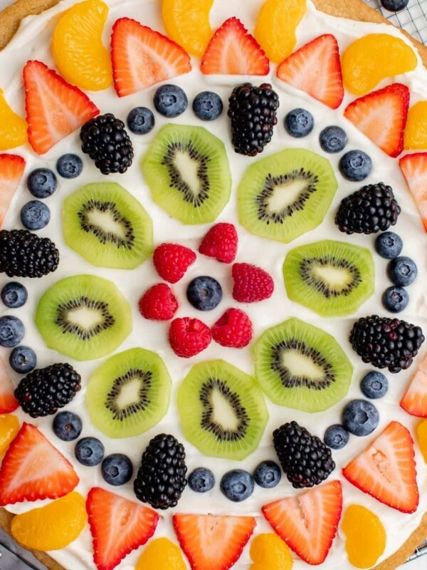 An easy homemade fruit pizza topped with berries and kiwis.
