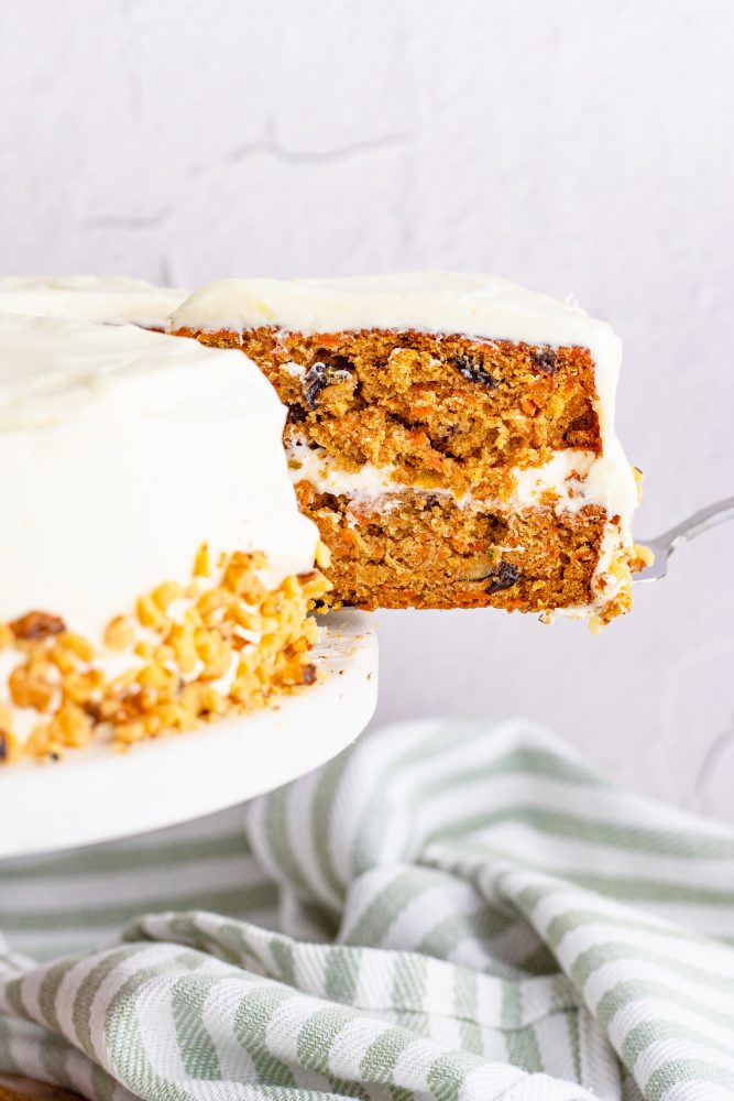 picture of layered carrot cake on a white plate