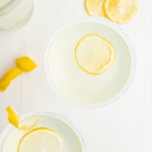 Lemon margaritas with a slice of lemon, perfect for a refreshing twist on the classic lemon drop martini recipe.