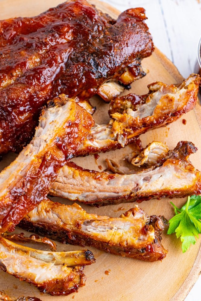 sliced grilled ribs on a table