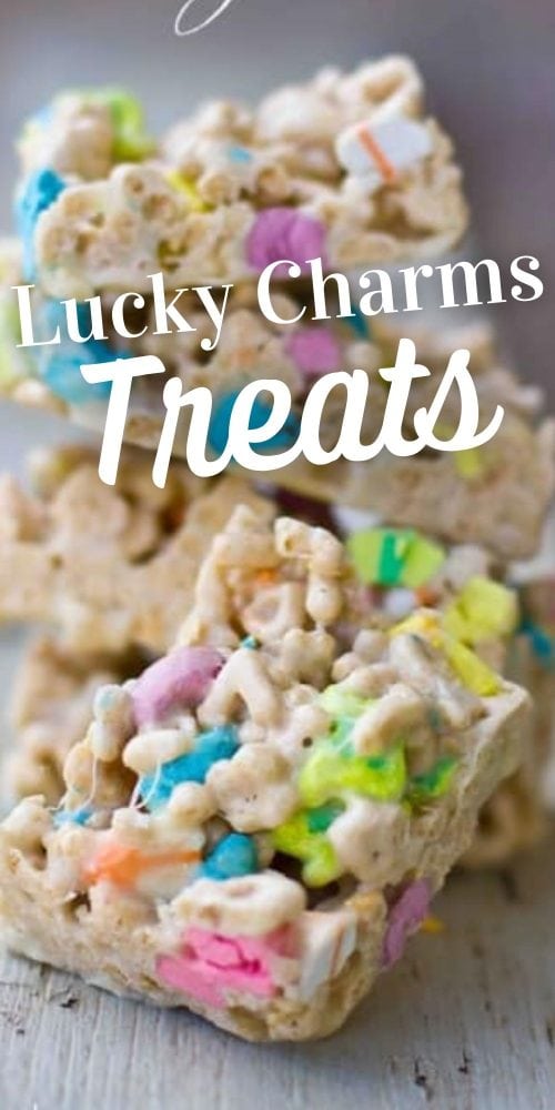 sliced Lucky Charms treats cereal bars on a piece of wood