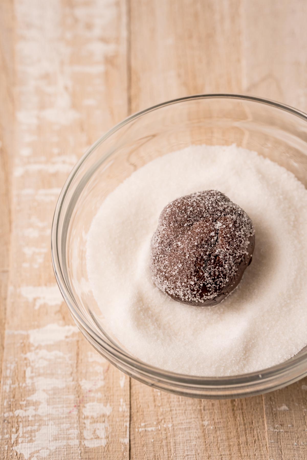 chocolate ball in a bowl of sugar rolled