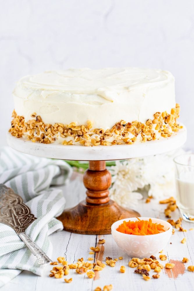 picture of layered carrot cake on a white plate