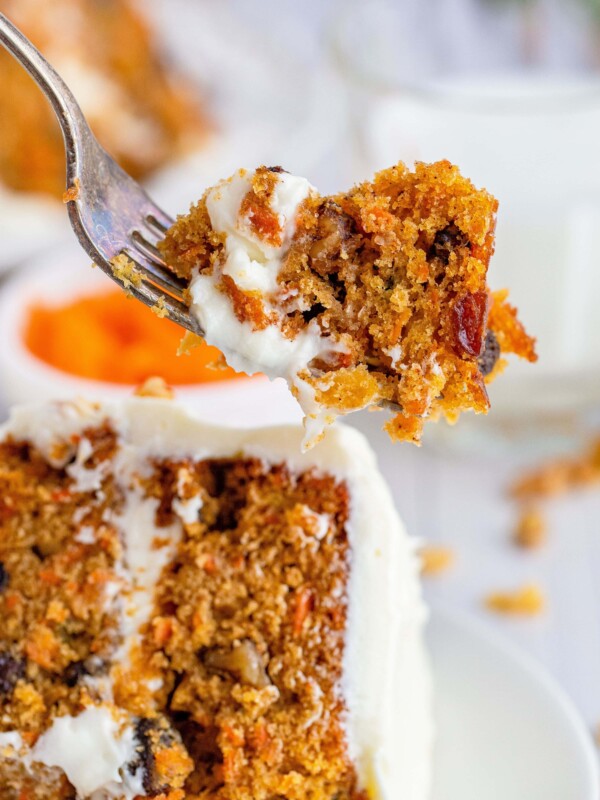 picture of layered carrot cake on a white plate