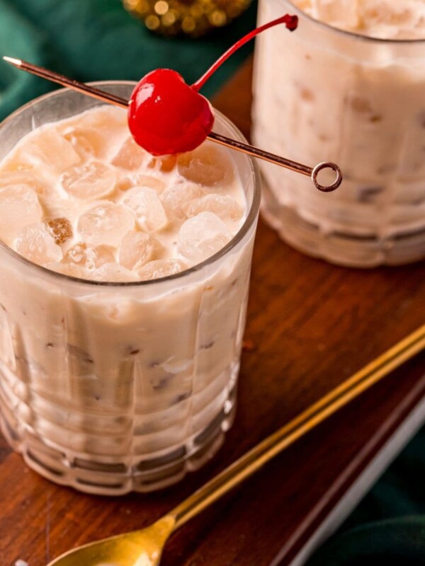 picture of a white russian in a glass with a cherry on a stick