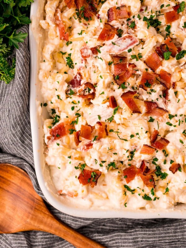 A bacon and cheese casserole with parsley.