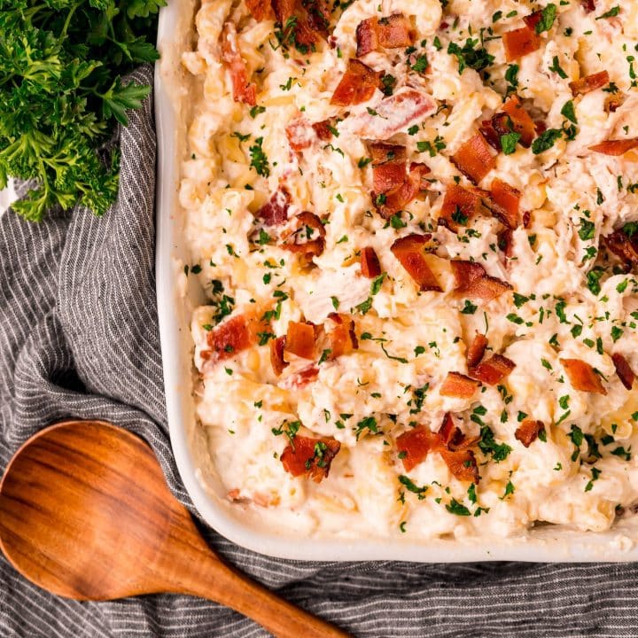 A bacon and cheese casserole with parsley.