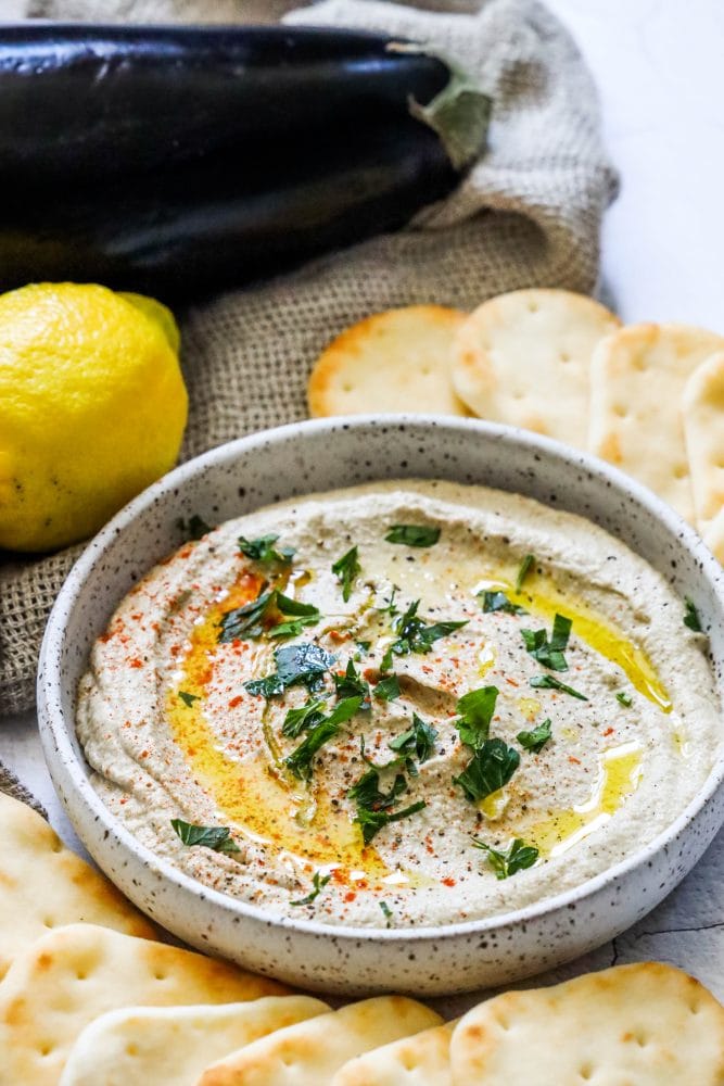 picture of baba ganoush on a table with pita