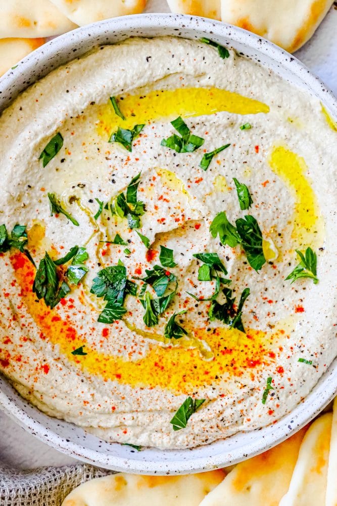 closeup picture of baba ganoush with cumin and olive oil on top 