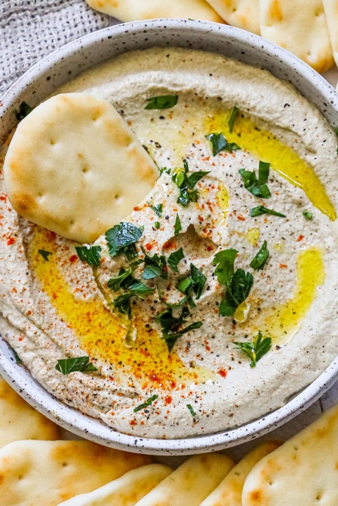 picture of baba ganoush in a plate with pita in it