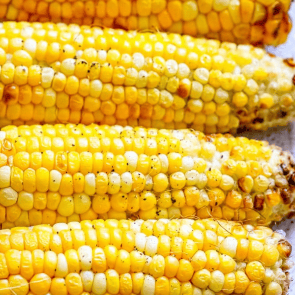 Grilled corn on the cob with some kernels charred from cooking in the air fryer.