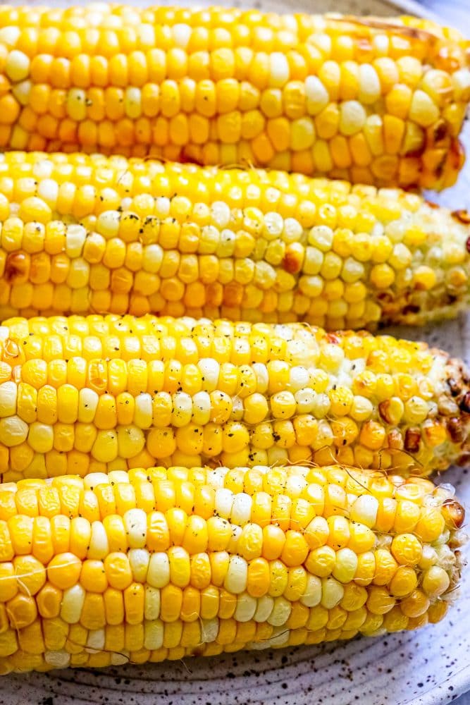 air fried ears of corn on a plate