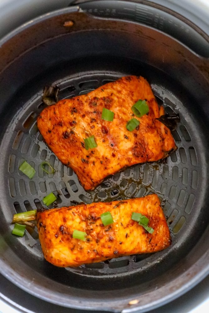 spicy salmon cooked in an air fryer basket
