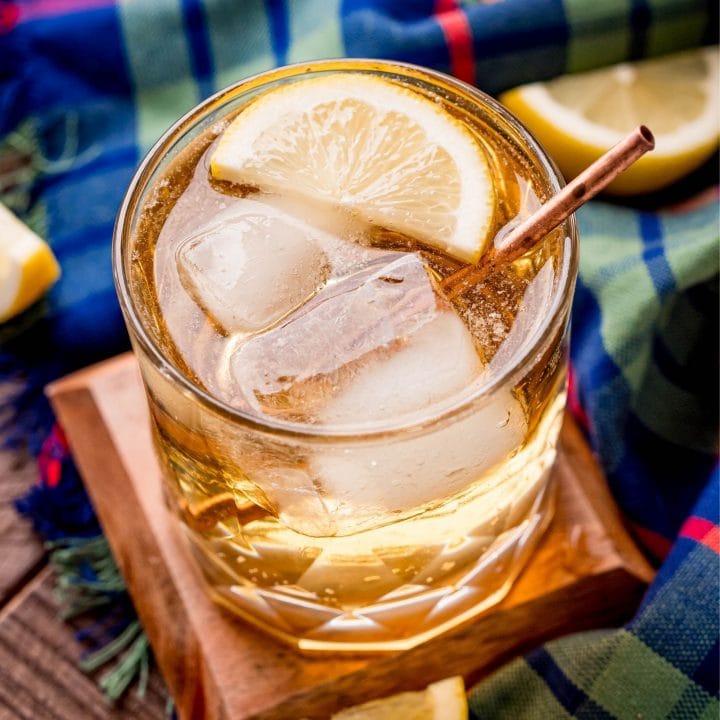 picture of scotch and soda with a slice of lemon in a glass with ice