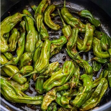 shishito peppers in a bowl on a table