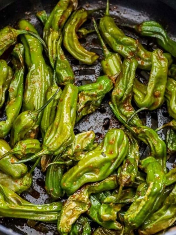 shishito peppers in a bowl on a table