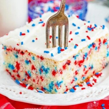 funfetti 4th of july cake iced with buttercream icing and a fork digging in