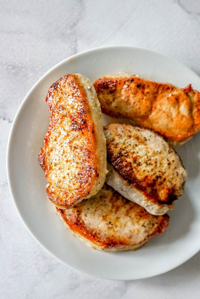 picture of pork chops on a white plate