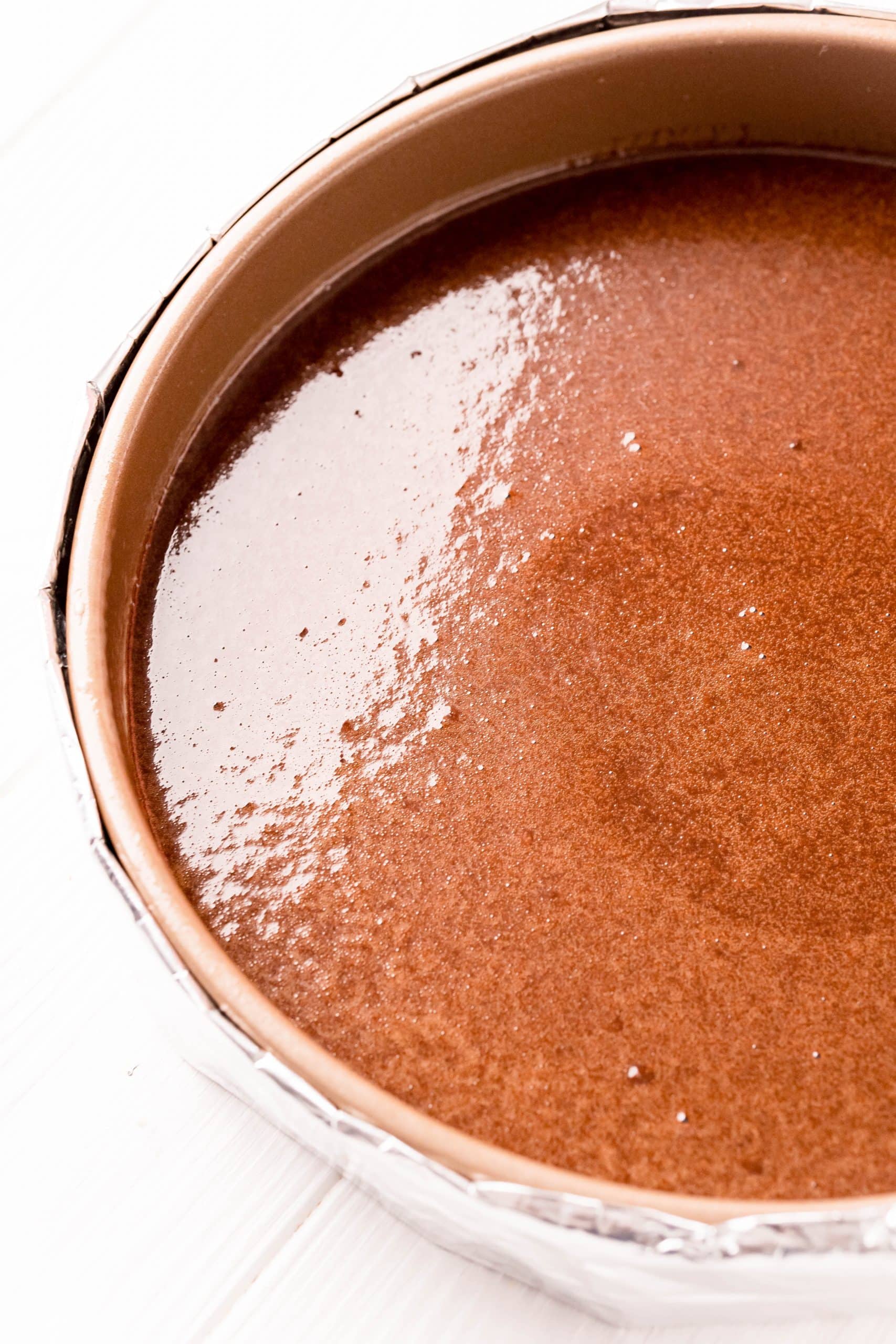 An easy and irresistible chocolate pie on a white table.