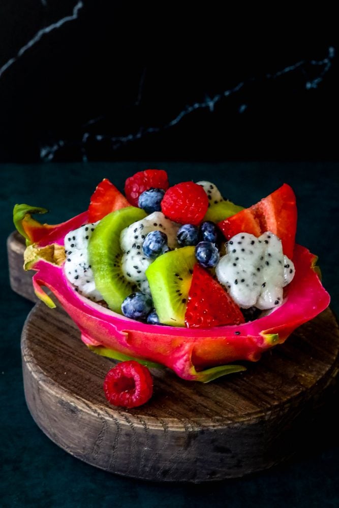 picture of diced fruit salad in a carved out dragon fruit hull