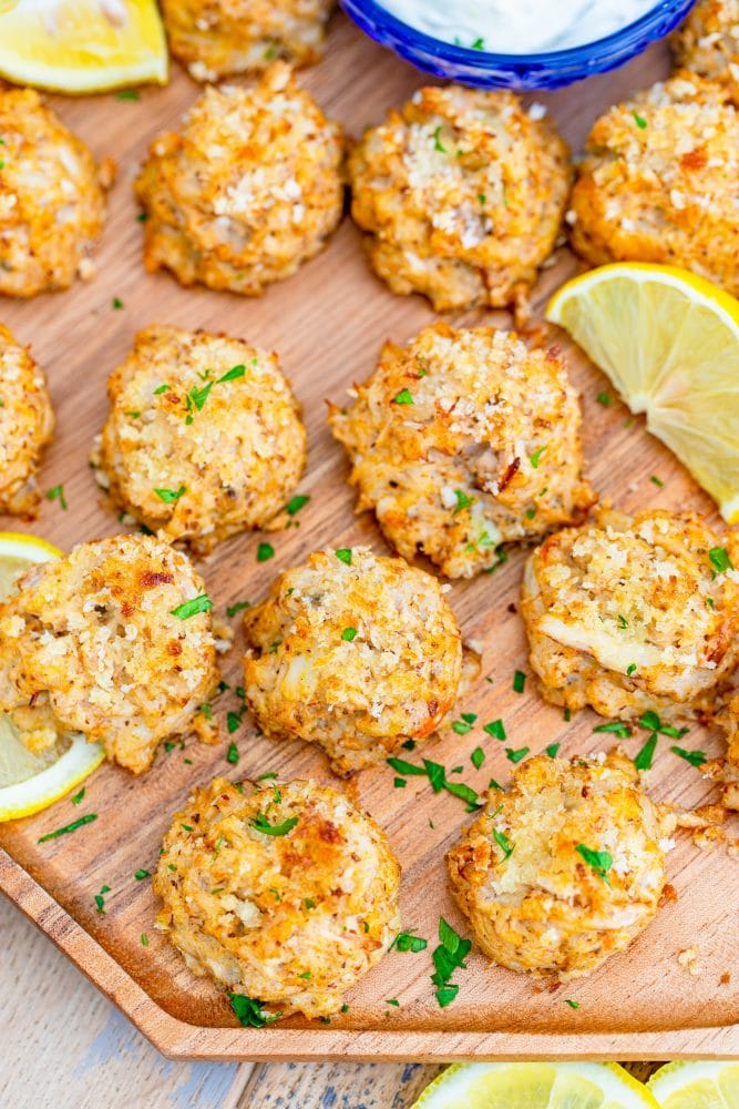 picture of crab cakes on a platter with lemon slices