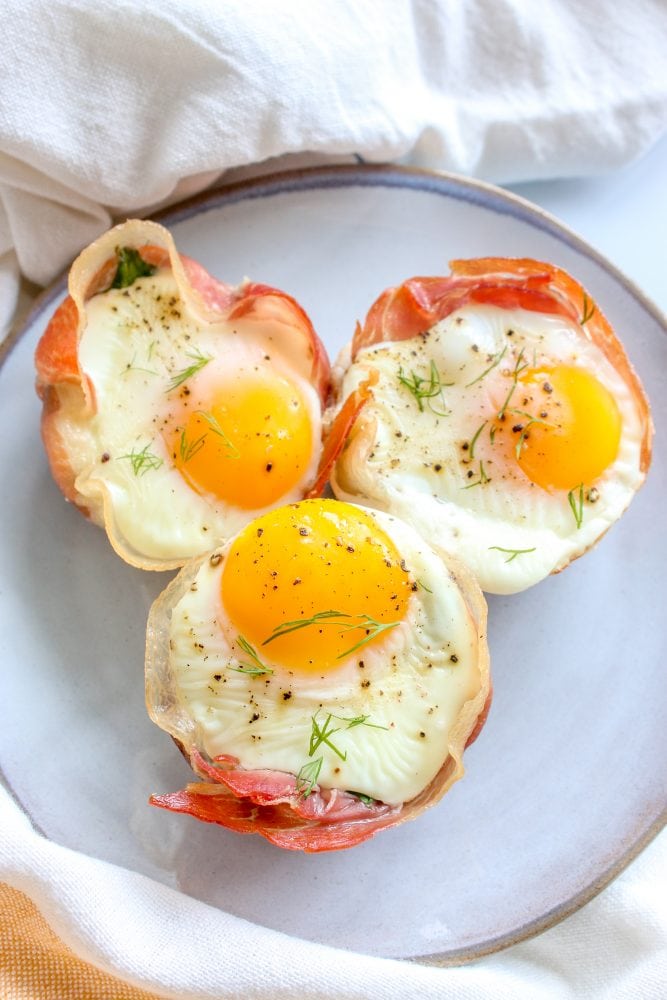 Over-Easy Eggs in Prosciutto Cups - Sweet Savory and Steph