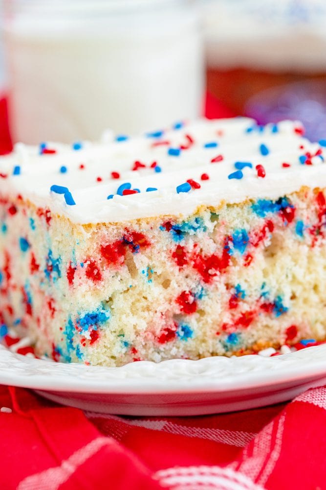  red white and blue funfetti sheet cake on a plate