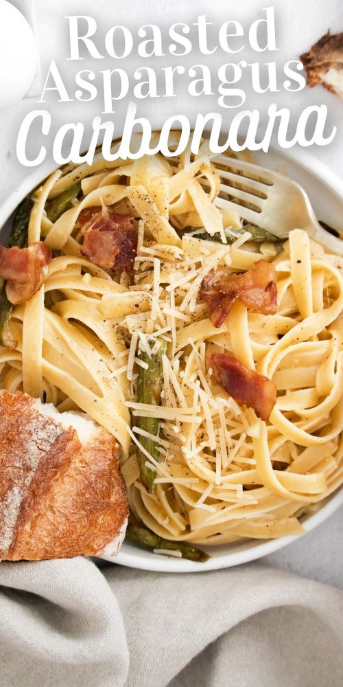 picture of a bowl with noodles, asparagus, parmesan cheese, bacon, and carbonara sauce