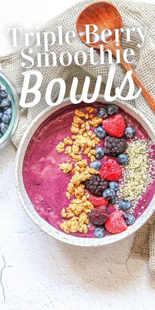 picture of berry smoothie bowl with raspberries, granola, blackberries, blueberries, and hemp hearts on top 