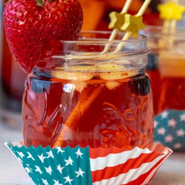 fruit punch with red white and blue fruit and 4th of july decor on a table