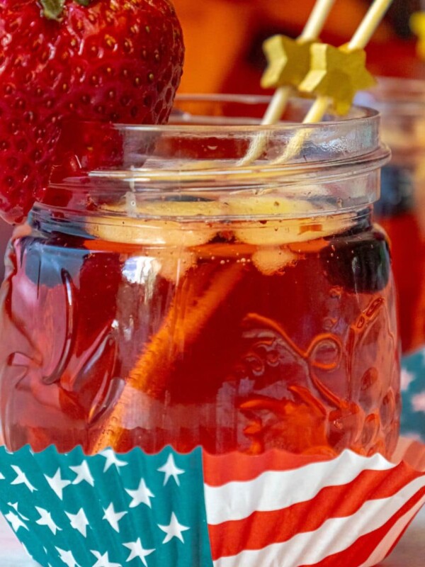 fruit punch with red white and blue fruit and 4th of july decor on a table