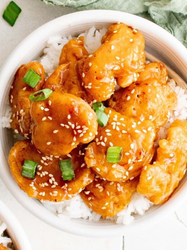 picture of sesame chicken on a bowl of rice