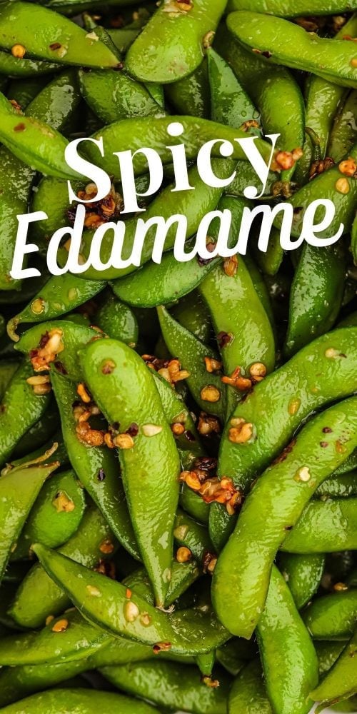 edamame beans in a bowl with spices on it. 