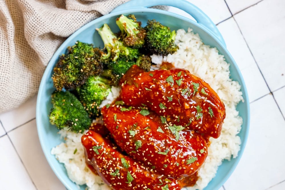 picture of honey garlic chicken on a plate with broccoli and rice