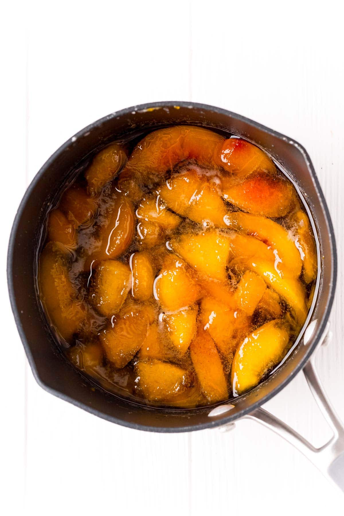 peaches in a pot in syrup