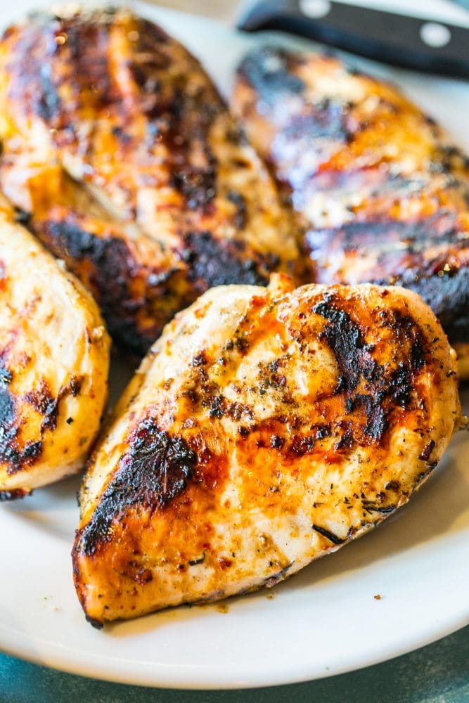 picture of grilled chicken breasts on a white plate 